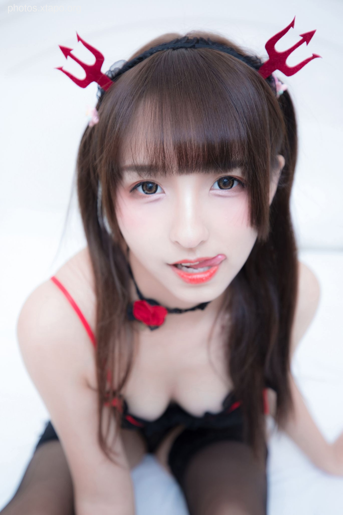A playful devilish girl in a cute lingerie set.