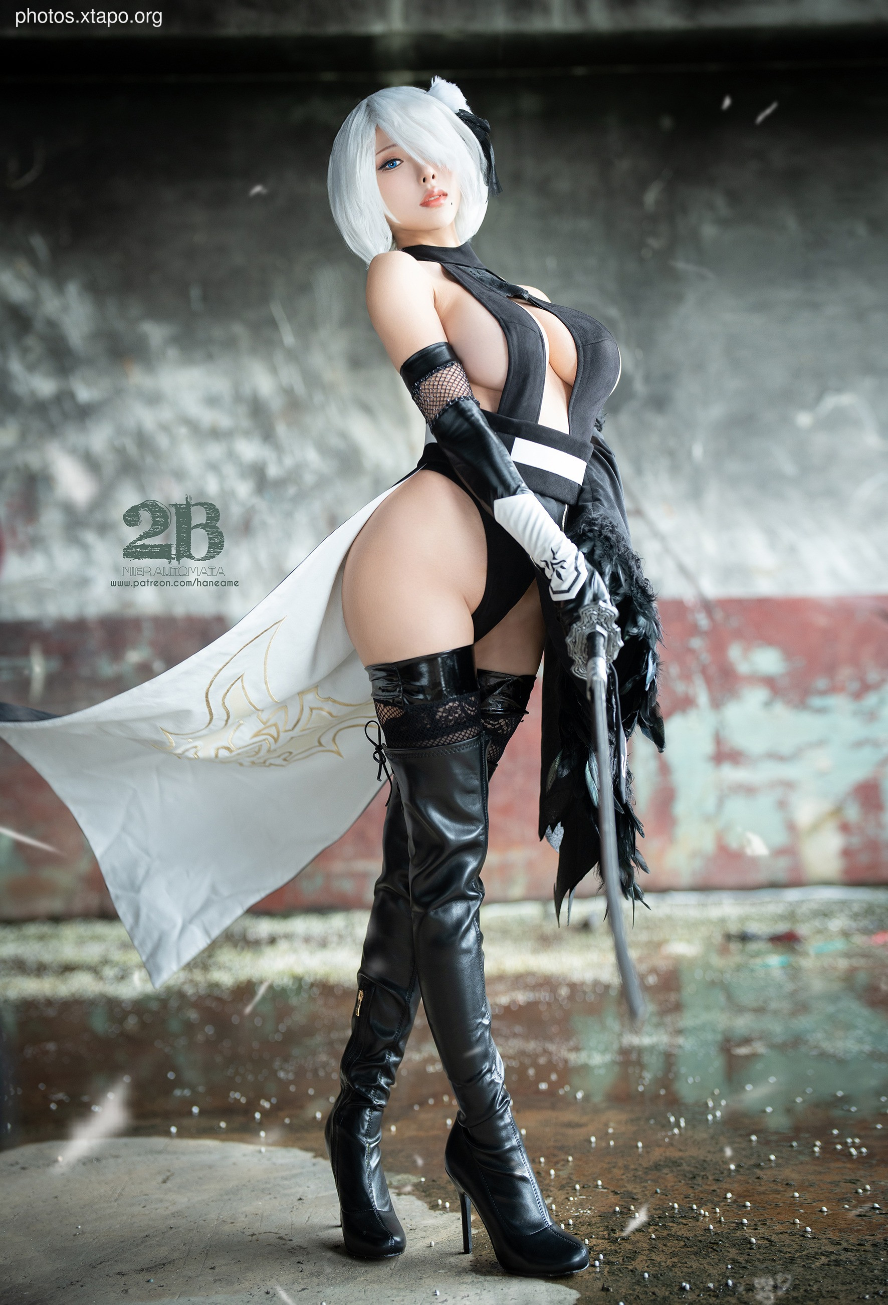 A stunning cosplay of 2B from Nier: Automata.  The model's attention to detail in the costume and pose is remarkable.