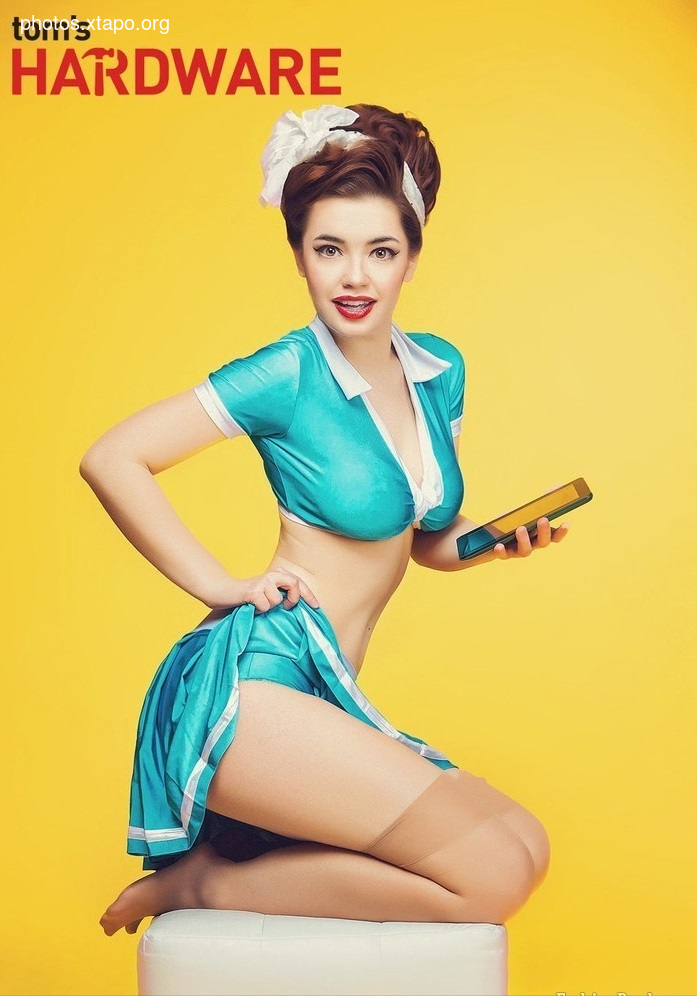 Pin-up girl in a teal uniform holding a tablet.  A vintage-style advertisement for computer hardware.