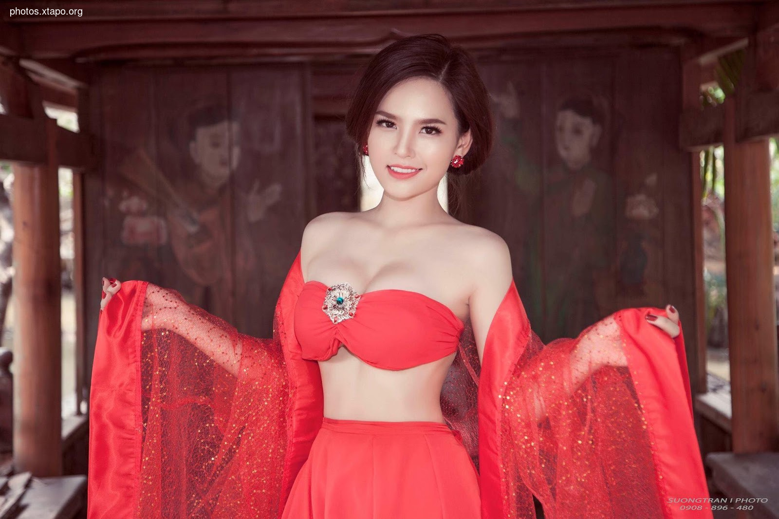 A woman in a vibrant red traditional Chinese-inspired dress. The intricate details and the model's captivating pose create a breathtaking image.