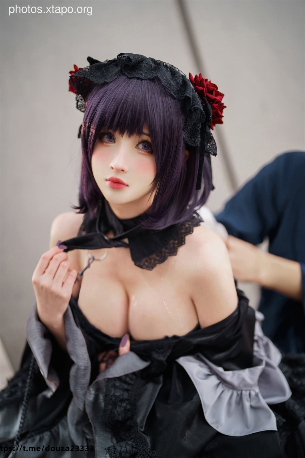 A captivating cosplay of a gothic lolita, showcasing intricate details and a striking pose.