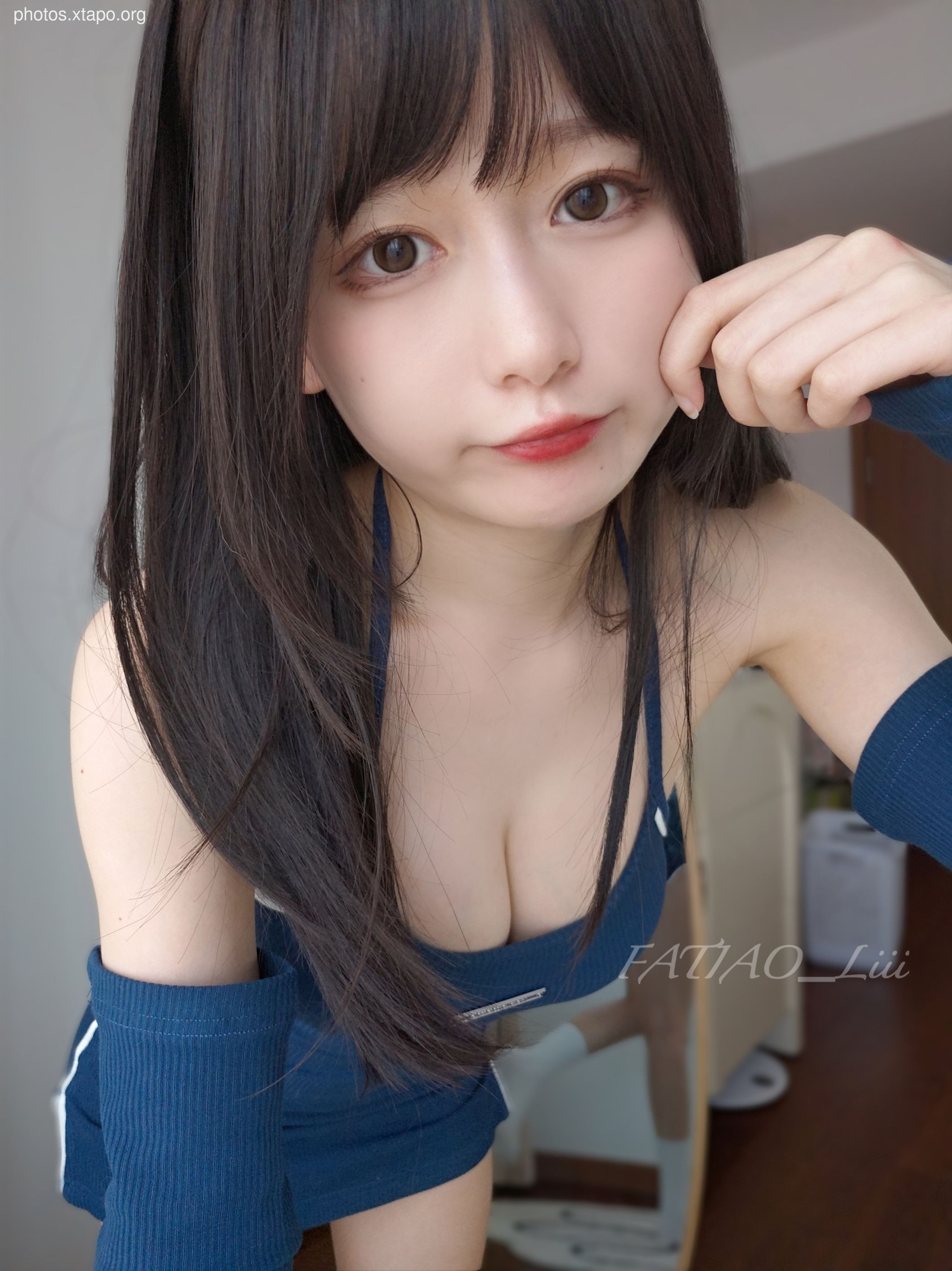 A playful portrait of a young woman, showcasing her playful side.