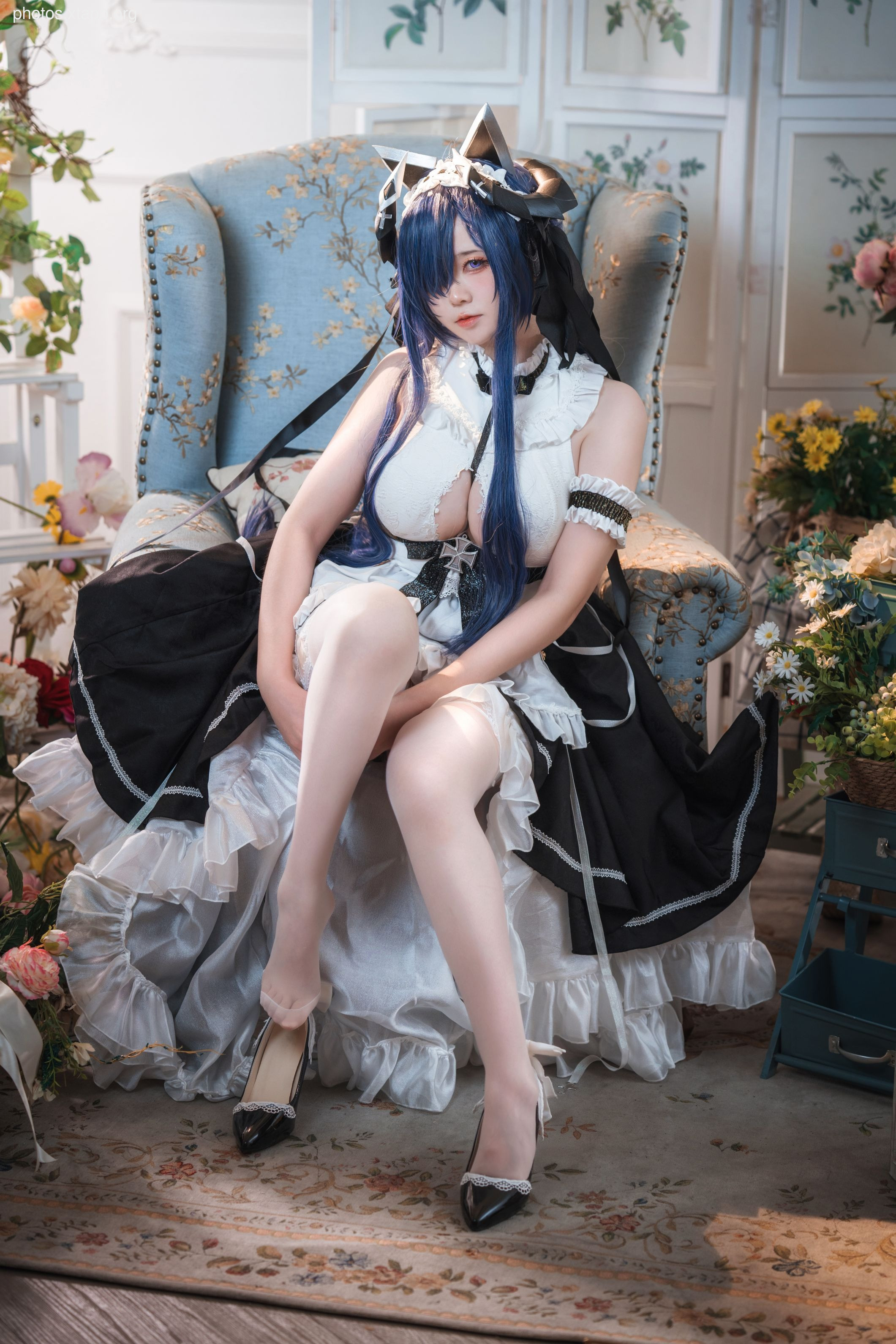 A captivating cosplay image of a maid in an elegant setting.  She is wearing a beautiful black and white dress with intricate details. The high-quality image is perfect for showcasing cosplay talent.