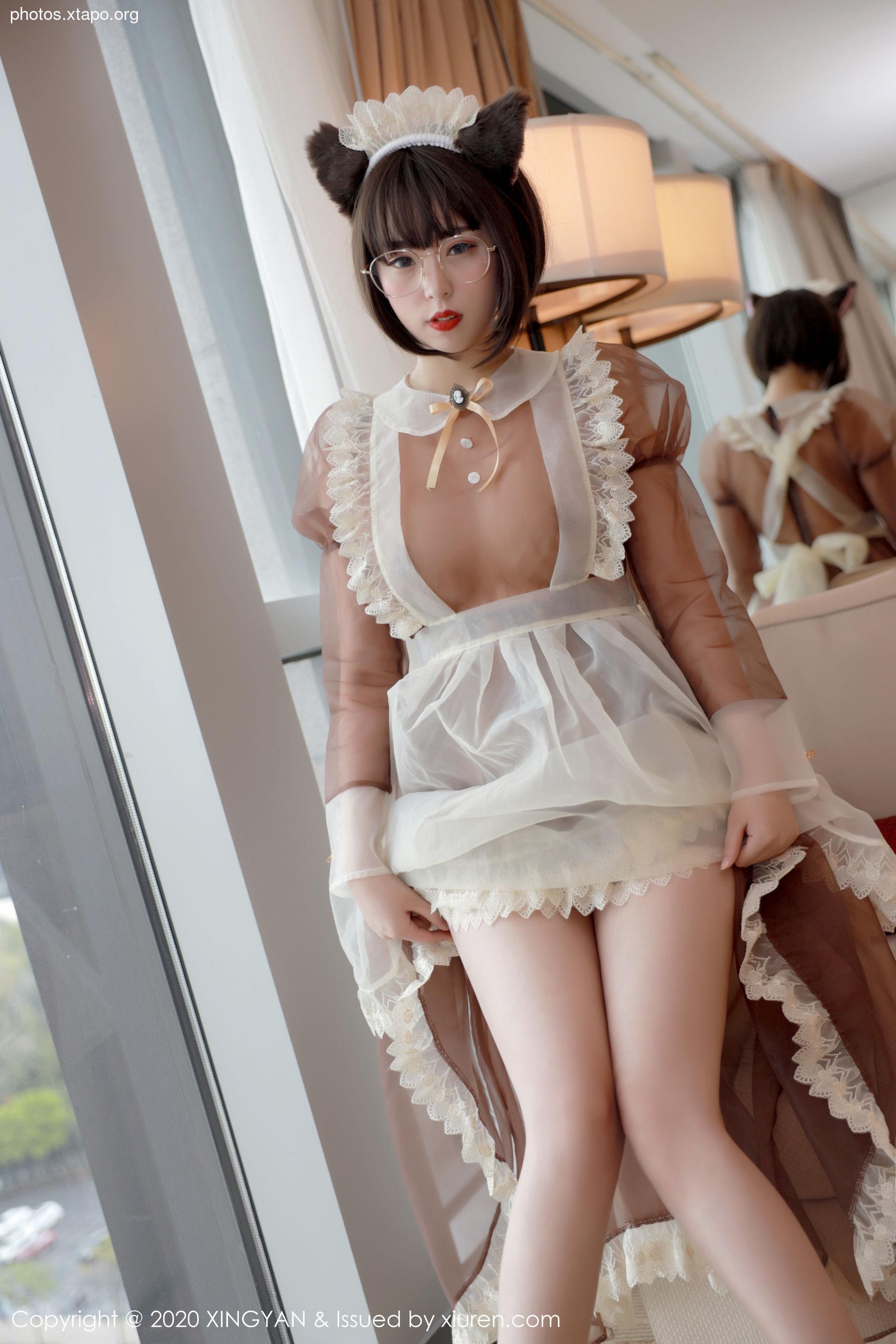 A playful maid in a sheer, ruffled apron and cat ears, caught in a moment of innocent fun.