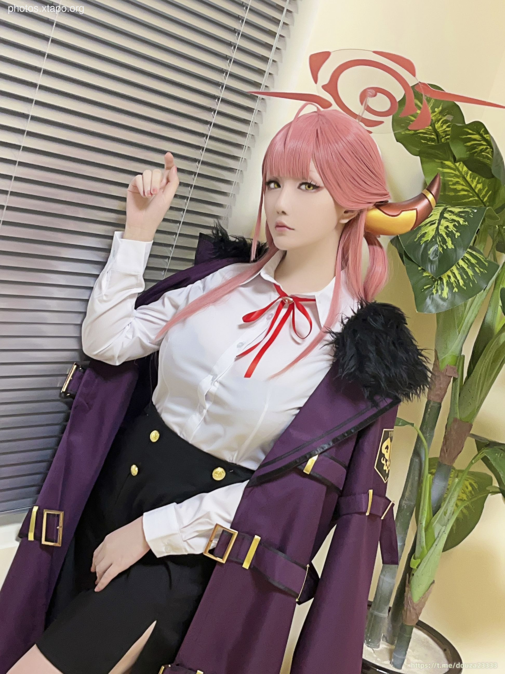 A captivating cosplay of a female anime character, showcasing intricate details in the costume and accessories.