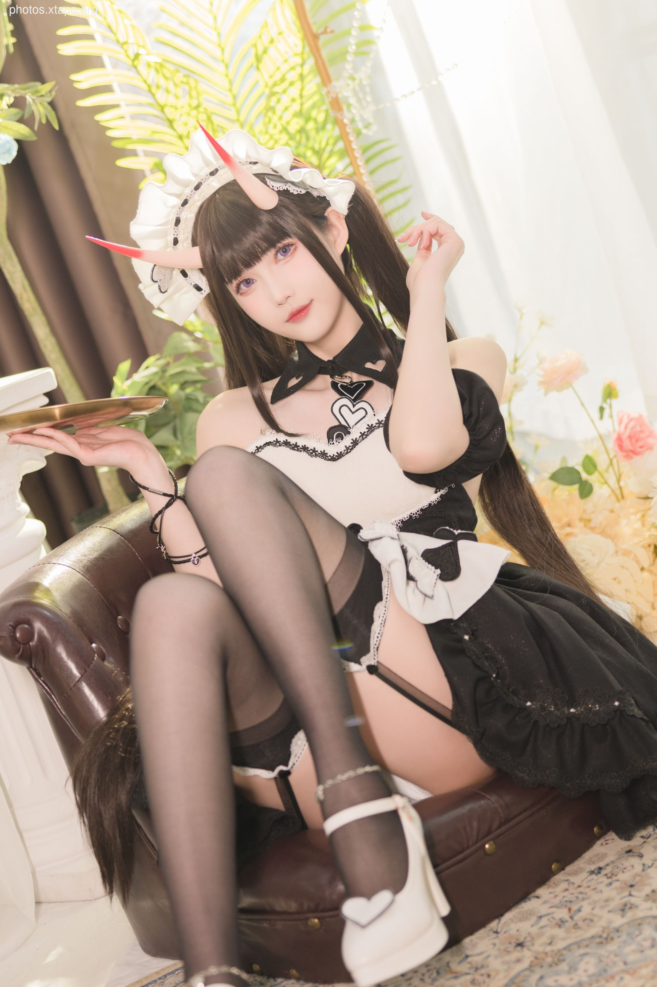 A captivating cosplay image of a devil maid, showcasing intricate details and a striking pose.