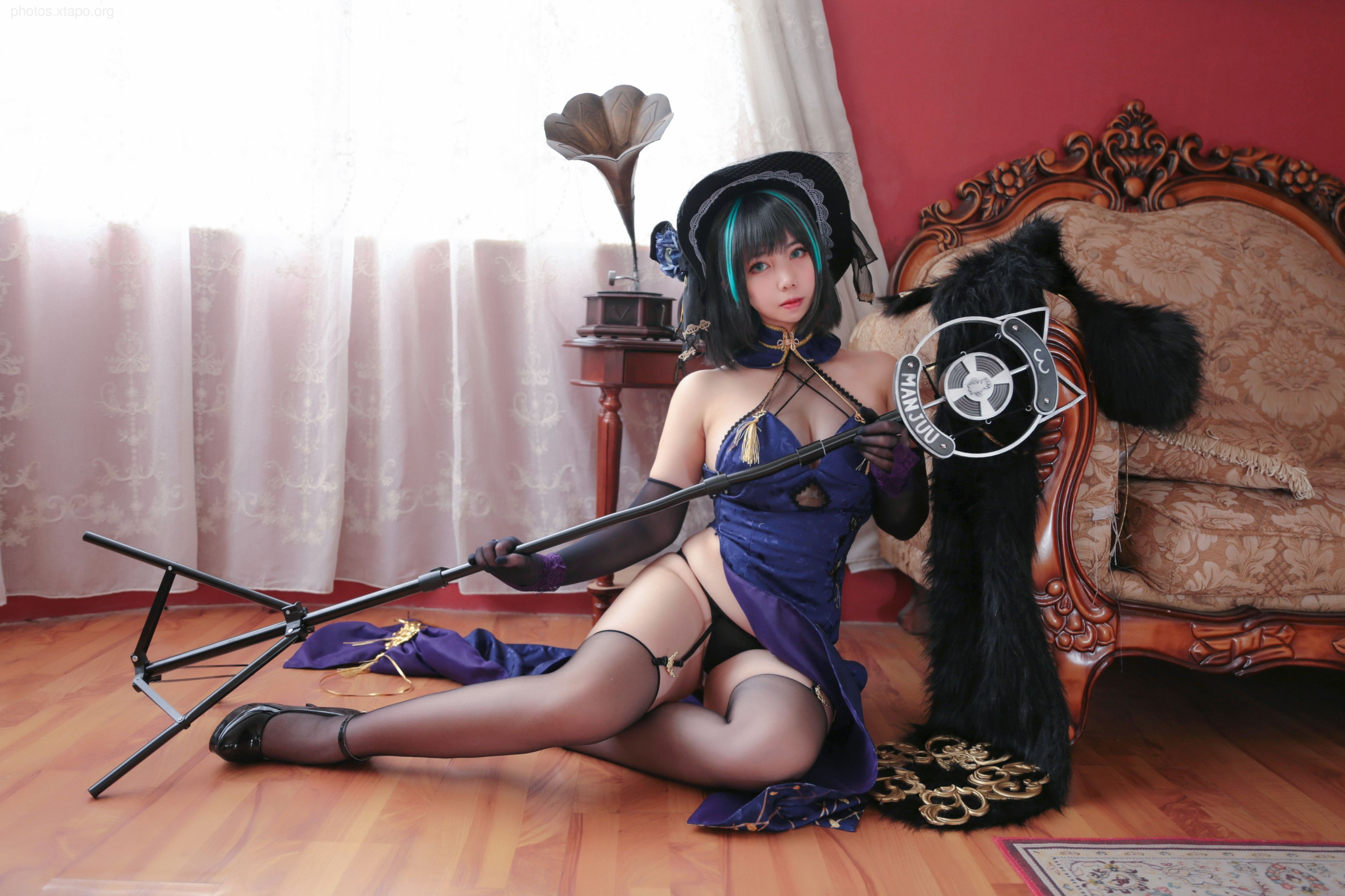 A captivating cosplay photoshoot featuring a model dressed as a character from a popular game or anime. She holds a microphone, and her pose suggests a punishment theme.