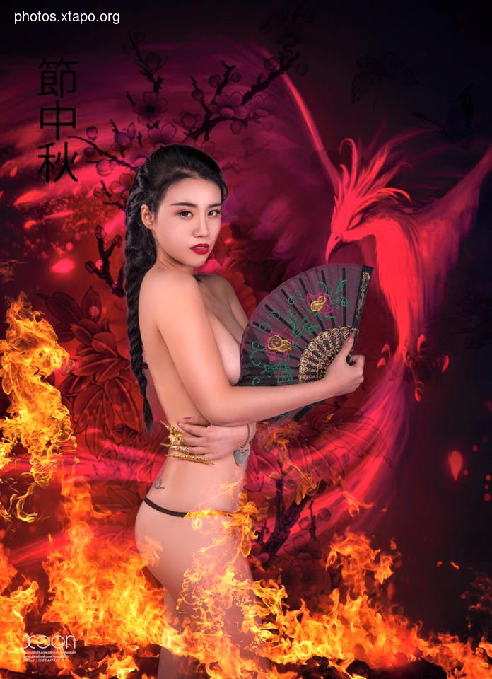 A woman in traditional Asian attire stands amidst flames, holding a fan, with a phoenix rising in the background.  The image evokes a sense of mystery and beauty.